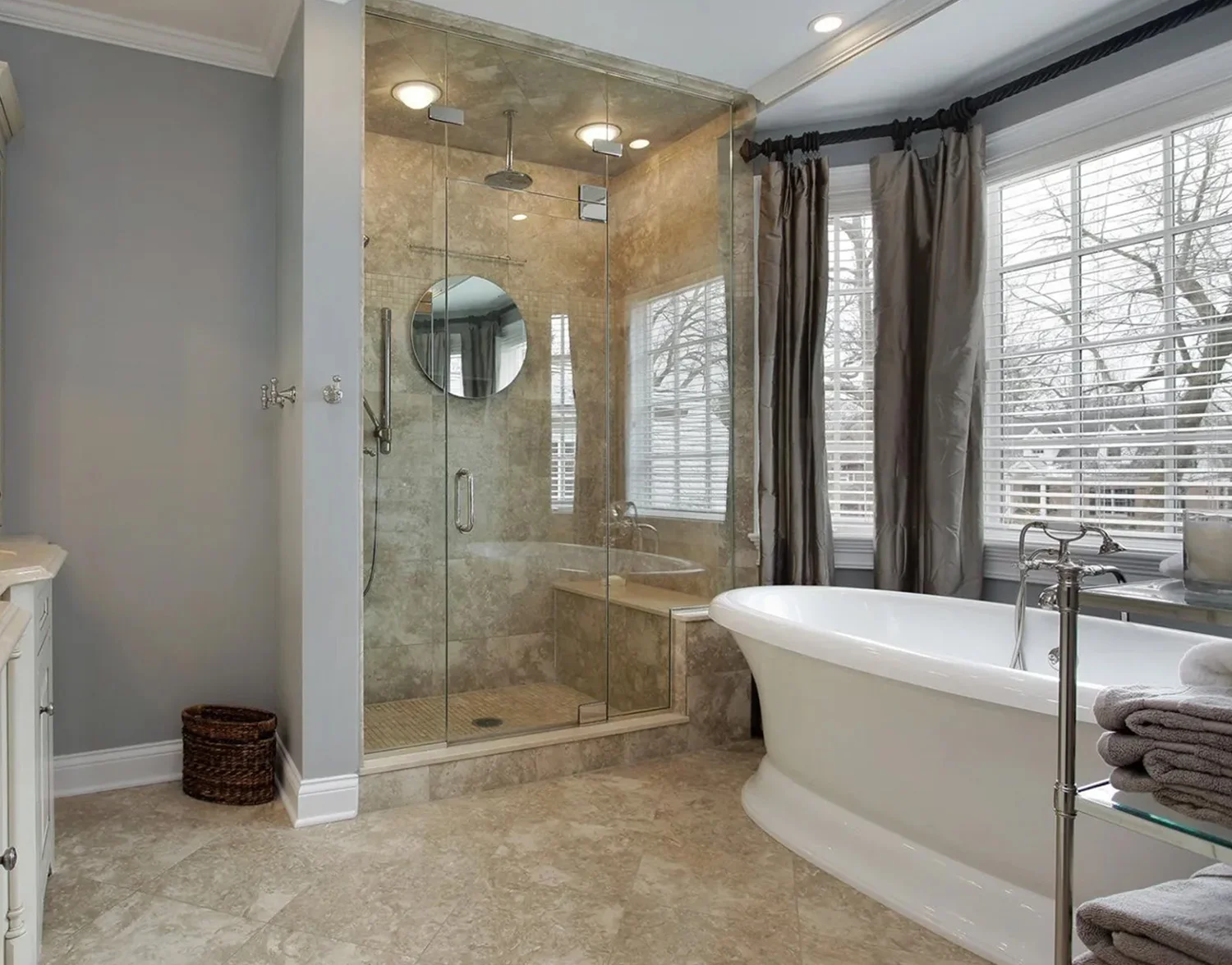 A bathroom with a tub, shower and window.